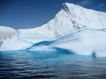 Beautiful shapes and colors of iceberg floating in Antarctic waters