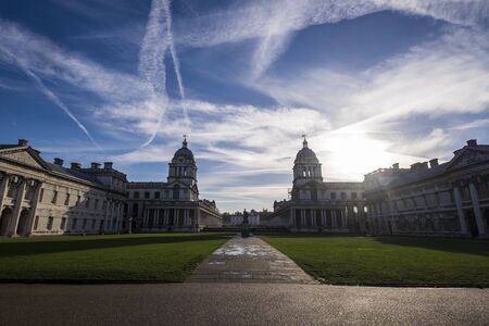 Panorama of Greenwich buildings, London against blue sky with vapour trailsのeditorial素材