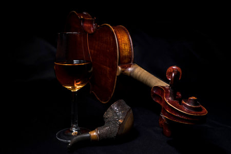 Still life photograph of vintage violin with glass of Scotch whisky and pipeの写真素材