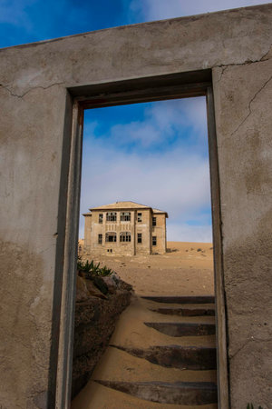 Looking through old door frame to Quartermeister, German for Quartermaster, building in the...