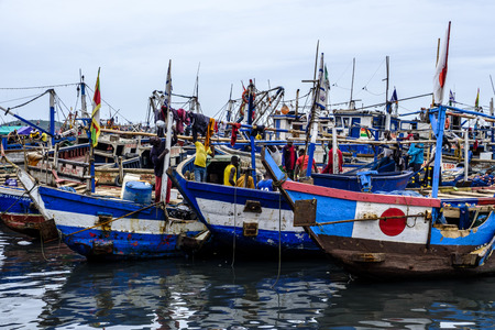 SEKONDI TAKORADI, GHANA â€“ 10 APRIL 2018: Busy harbour scene as fishermen land thier catch...
