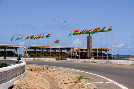 ACCRA,GHANA - APRIL 11 2018: Looking across roundabout towards the seating and flags of Ghana in Indpendence Square in Accra, venue for Independence Day and other national celebrationsのeditorial素材