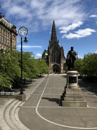 GLASGOW, SCOTLAND â JULY 07 2018: Glasgow Cathedral also known as High Kirk of Glasgow with statue of David Livingstone, doctor missionary and explorerのeditorial素材
