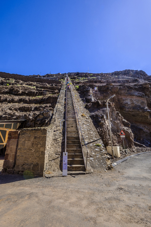 ST HELENA ISLAND, SOUTH ATLANTIC - APRIL 2 2018: Group of tourists climbing down the 699 steep steps of Jacobs Ladder in Jamestown Saint Helenaのeditorial素材