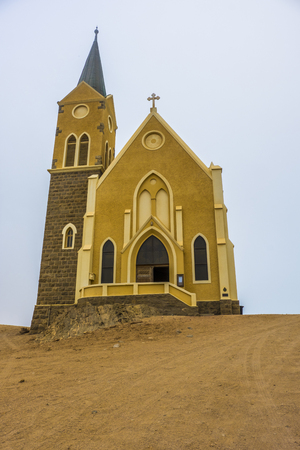 LUDERITZ, NAMIBIA - MARCH 23 2018: Iconic Evangelical Lutheran Felsenkirche, the church on the rocks, highest place in Luderitz, consecrated in 1912.のeditorial素材