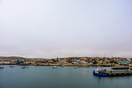 LUDERITZ, NAMIBIA - MARCH 23 2018: Looking across the bay to remote Namibian town of Luderitz, under cloudy skiesのeditorial素材