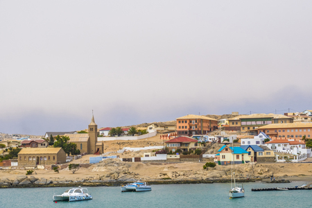 LUDERITZ, NAMIBIA - MARCH 23 2018: Remote Namibian town of Luderitz, under cloudy skies, taken from the bayのeditorial素材