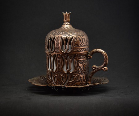 Antique Turkish tea cup with black background.の写真素材