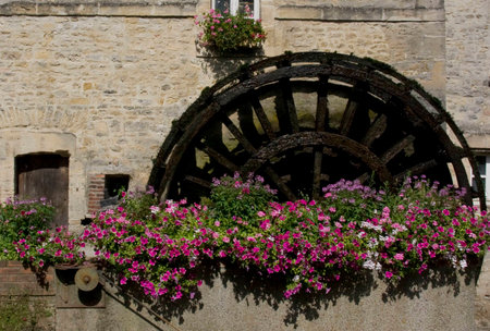 An old water mill wheel in Bayeuxの写真素材