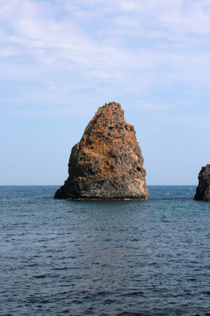 A sea stack facing the Sicilian coastの写真素材