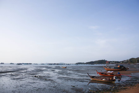 Long-tailed Boat on Lower Tide at Ao Po Beach の写真素材