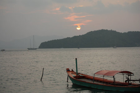 Sunset with a Boatの写真素材
