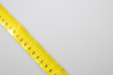 Yellow meter in a white backgraundの写真素材