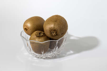 Kiwi in a crystal glass in a white backgroundの写真素材
