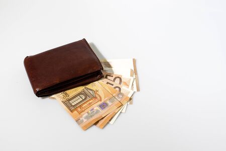 Wallet with money composition in a white backgroundの写真素材