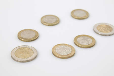 Coins business composition in a white backgroundの写真素材