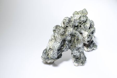 aquarium accessories rock in a white background compositionの写真素材