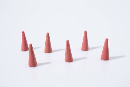 Red incense in a white backgroundの写真素材