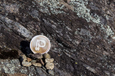 Cryptocurrency mining peercoin in a rock background compositionの写真素材