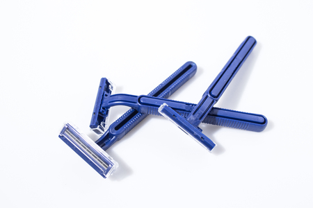 Blue shaving razor isolated in a white background compositionの写真素材