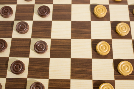 Strategy games, detailed wood chessboard with pawns composition