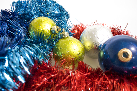 Christmas tree decorations, colorated balls isolated in a whte background compositionの写真素材