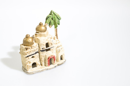Christmas decorations, nativity scene houses isolated in a white background compositionの写真素材