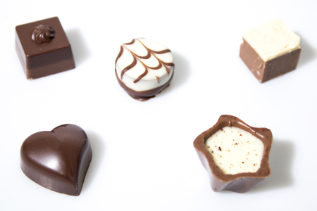 Many chocolates isolated in a white background compositionの写真素材