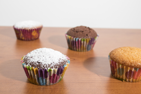 Cupcakes on a wood table compositionの写真素材