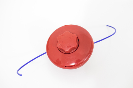Red trimmer head with a blue wire compositionの写真素材