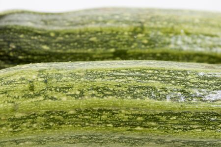 Green vegetables zucchini in a background in a compositionの写真素材