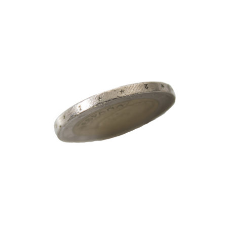A side view of a coin isolated in a white background detailed