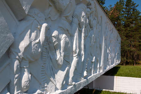 Russia, Luga, Leningrad oblast - 11 July 2020: photo shows a woman crying over a killed soldier. This is Monument "Artillery-glory!"のeditorial素材