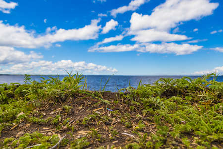 lake and sky and white cloudsの写真素材