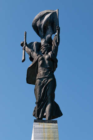 Russia, Luga, Leningrad oblast - 11 July 2020: photo shows a warrior with a machine gun in his hand. This is Monument "Artillery-glory!"のeditorial素材