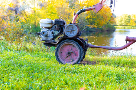 Small tractor for soil cultivation and potato planting. It is autmnの写真素材