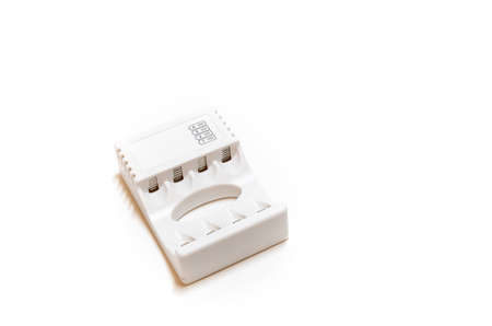 white charger for batteries on a white backgroundの写真素材