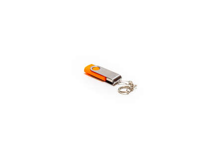 orange USB flash drive on white backgroundの写真素材