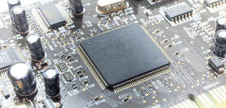 close up computer chips and elements on the board