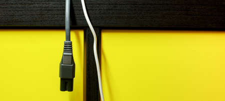 electrical wire on yellow background. close-upの写真素材