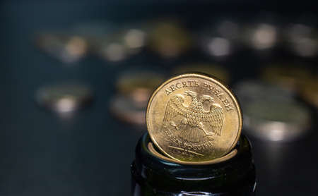 coin of 10 rubles is in the neck of a glass bottleの写真素材