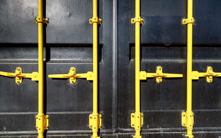 cargo container in black with yellow locks