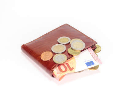 euro coins lie on a wallet, isolated objectの写真素材