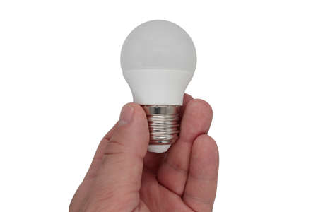 man holding a light bulb in his hands on a white background, isolateの写真素材