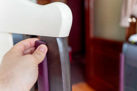 man covers baby safety corner protector of the crib for the safety of the babyの写真素材