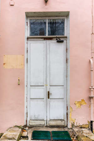 antique door on the background of broken stepsの写真素材