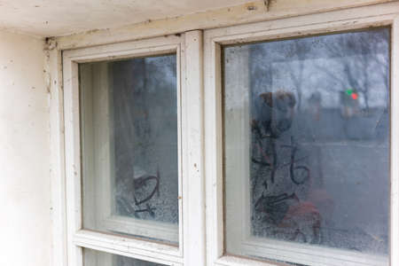 part of a wooden window with glass close-upの写真素材