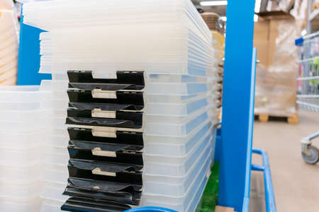Folded transparent plastic containers boxes at storeの写真素材