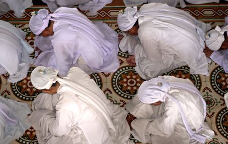 Tay Ninh, Vietnam, September 1, 2008 - Praying in the Cao Dai churchのeditorial素材