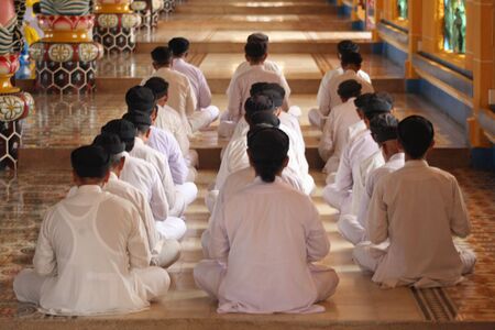 Tay Ninh, Vietnam, September 1, 2008 - Praying in the Cao Dai churchのeditorial素材